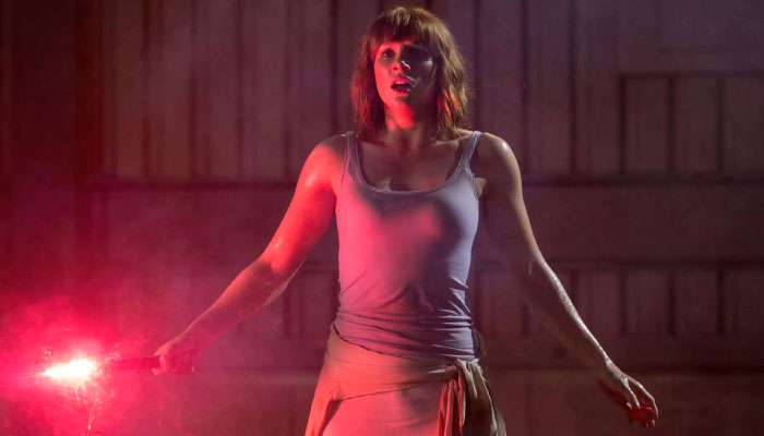 At The Beginning Of Jurassic World, The T-Rex Is Shown To Be Flare Trained - The T-Rex Follows The Flare And Receives A Meal. The T-Rex Is Not Trying To Catch The Flare, Its Following The Flare. This Is How A Woman In Heels Is Able To "Outrun" A T-Rex