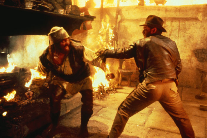 In Original Indiana Jones Trilogy, The Only Person Besides Harrison Ford To Appear In All Three Movies Was British Wrestler Pat Roach. He Was Also Killed Twice In "Raiders"