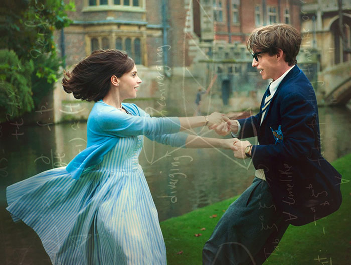 Scene from The Theory Of Everything movie showing a young couple spinning joyfully outdoors, highlighting fun facts about movies.