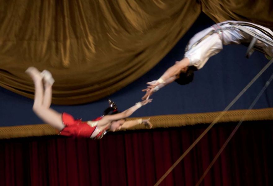 Acrobats performing a flip 