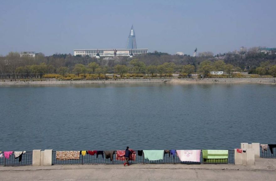 Carpets drying on the banks of the Taedong River