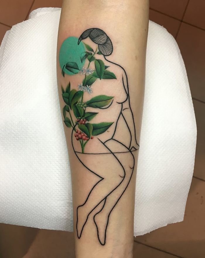 Tattoo of a figure intertwined with plants, symbolizing the relationship between nature and humans.
