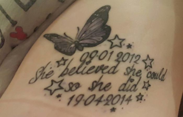 Butterfly tattoo with dates and motivational quote, representing personal stories behind tattoos.