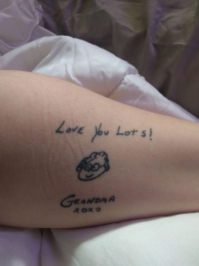 Tattoo featuring "Love You Lots" message, a simple drawing, and "Grandma XOXO", symbolizing personal stories behind tattoos.