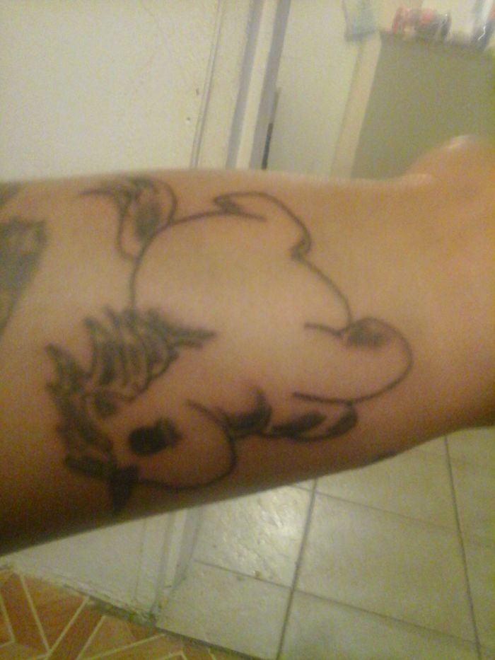 A tattoo featuring an abstract design on a person's arm, highlighting personal stories and meanings behind tattoos.