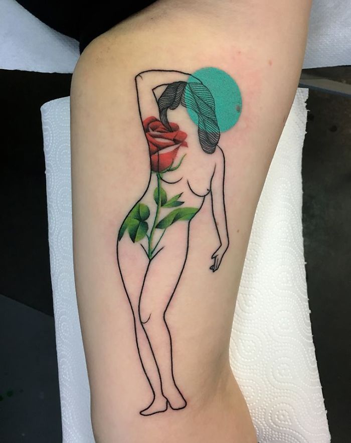 Tattoo of a human figure with floral and nature elements on forearm, symbolizing the relationship between nature and humans.