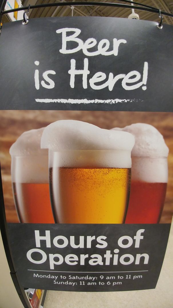 Sign advertising beer with hours of operation, featuring images of frothy beer glasses for Photoshop fails content.