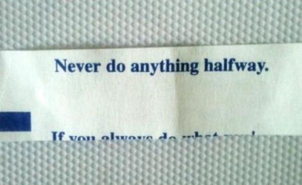 Sassy fortune cookie saying: "Never do anything halfway" on a textured background.