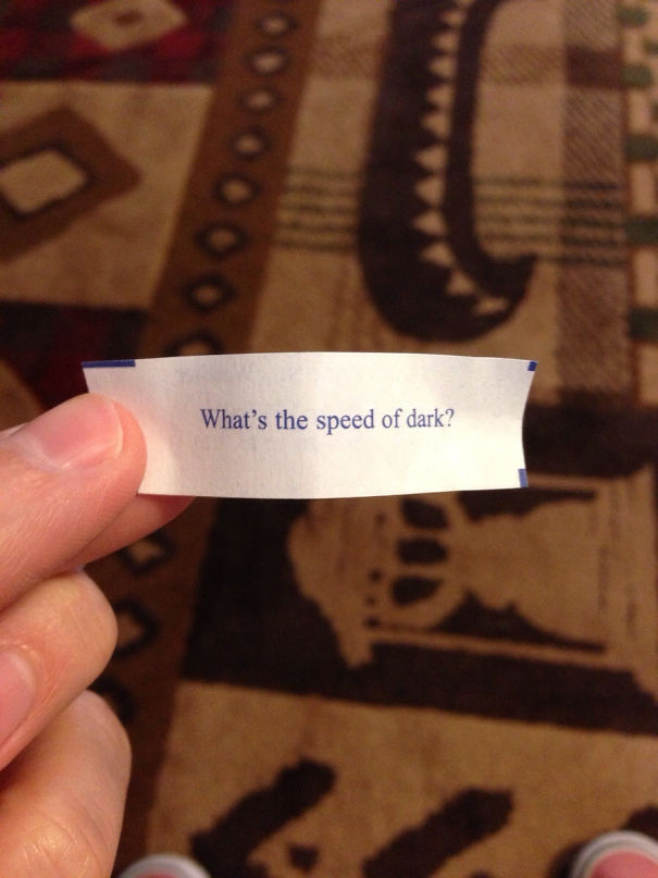 Fortune cookie message asking humorously, "What's the speed of dark?"