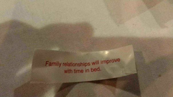 Fortune cookie with sassy saying: "Family relationships will improve with time in bed."