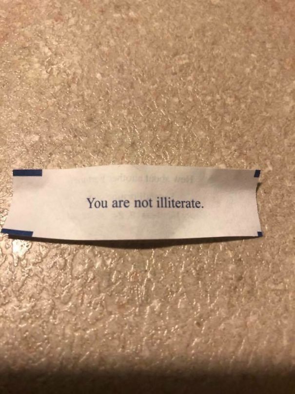 Sassy fortune cookie saying on a slip reads, "You are not illiterate."