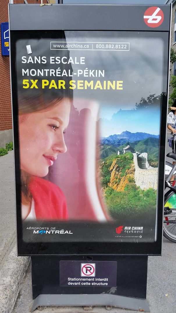 Advertising poster with a woman and a warped Great Wall of China, showcasing hilarious and disastrous Photoshop fails outdoors.