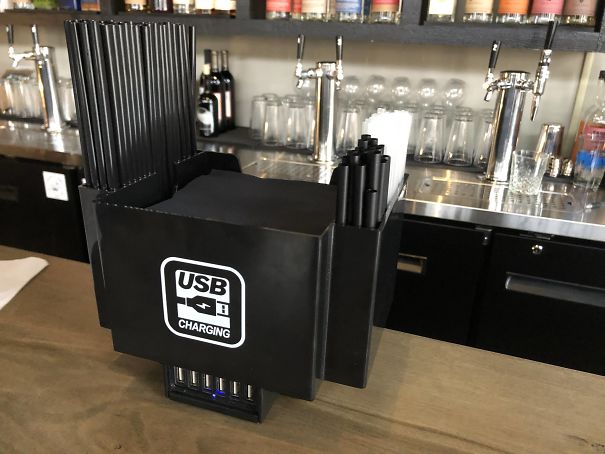 This Bar Has Powered USB Hub Napkin/Straw Holders For Their Patrons