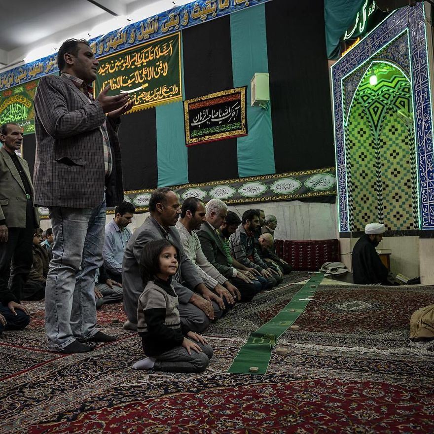 A Father And His Daughter Pray Together In The Mosque