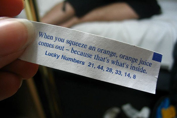 Fortune cookie with a sassy saying about oranges and juice, featuring lucky numbers below.