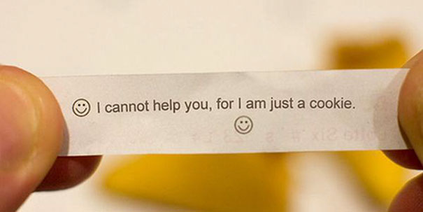 Sassy fortune cookie message saying, "I cannot help you, for I am just a cookie," with smiley faces.