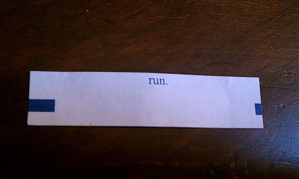 Fortune cookie paper with a sassy saying: "run."