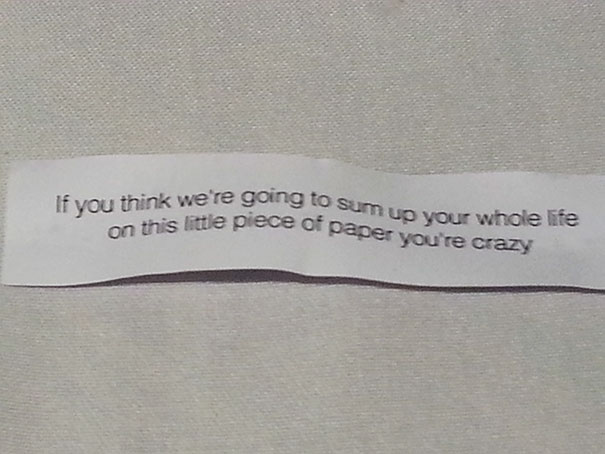 Sassy fortune cookie message with bold text on white paper displaying humor and attitude.