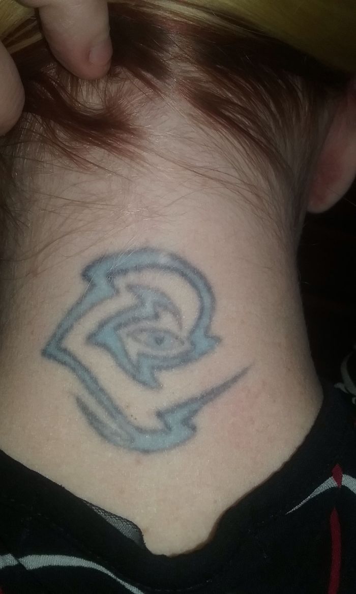 Neck tattoo of an abstract blue design, showcasing personal stories behind tattoos.