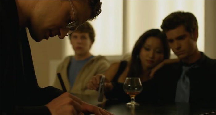 In The Social Network,in The Restaurant Scene With Shawn, There Is A Brief Shot Of Him With His Glasses On (Only Time They’re On In The Scene) Signing Off On The Cheque For Dinner. This Shows That Even When Eating At A Familiar Diner, He Is Careful About What He Signs, Something That Edouardo Is Not