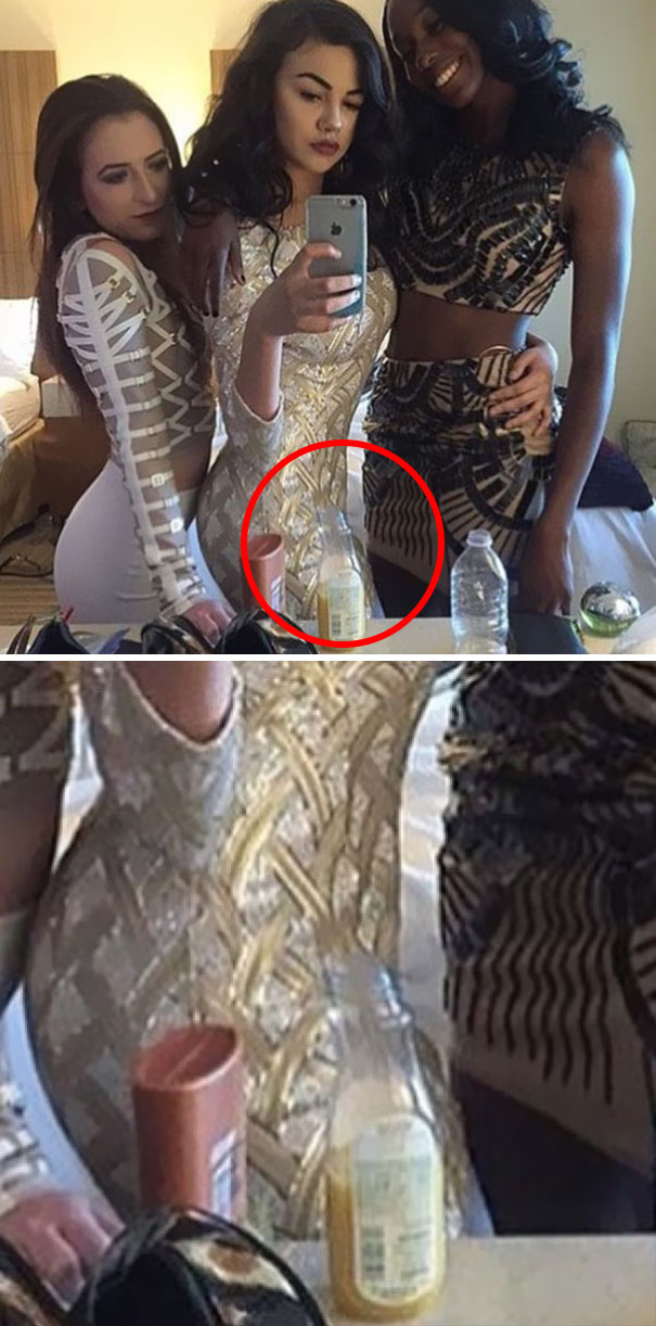 Three women taking a selfie in a mirror with a hilarious Photoshop fail distorting their bodies in the reflection.