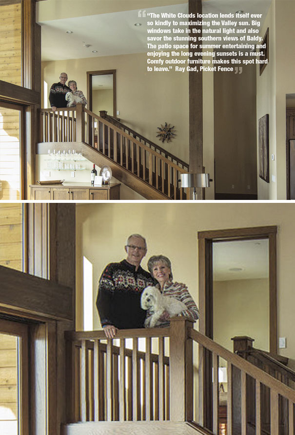 Couple holding a dog on a staircase in a home interior with a Photoshop fail showing duplicated arms and distorted railing.