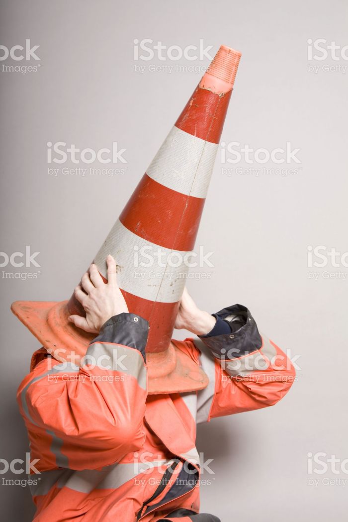 Traffic cone placed on the head