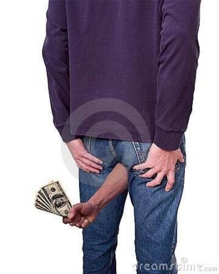 A hand with paper money coming out of person's b**t
