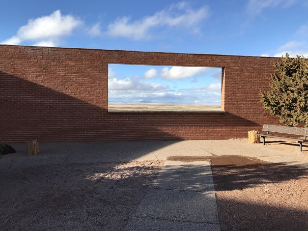 The Opening In This Wall Looks Like A Piece Of Art Hanging On It