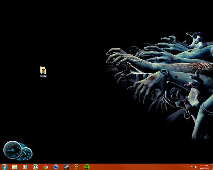 Hilariously genius desktop wallpaper with zombie hands reaching for a "Brains" folder on a black background.