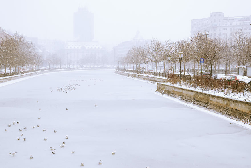 Dambovita River And The City Centre In The Foggy Background