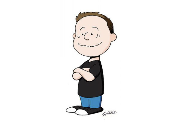 Cartoonist self-portrait in Peanuts style, arms crossed, wearing a black shirt and blue jeans.