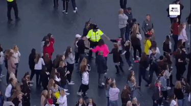 Cops Dancing With Children At Benefit Concert In Manchester