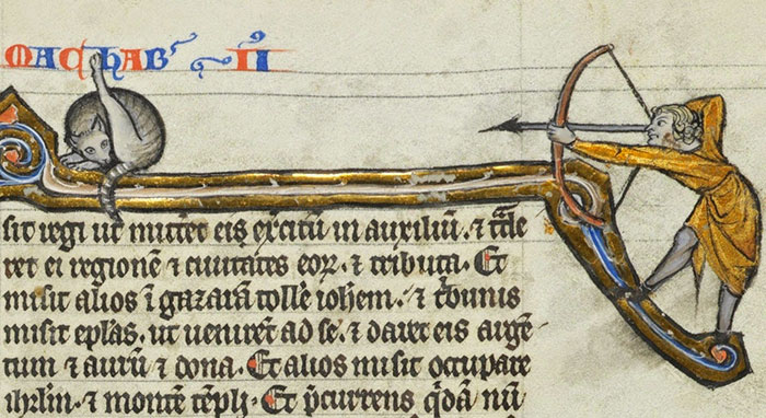 Medieval painting of a cat on a manuscript, depicting an unusual scene with an archer and arrow.