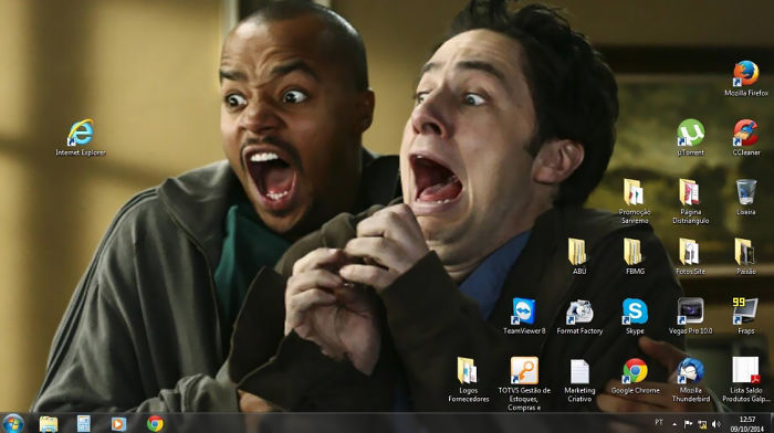 Hilarious genius desktop wallpaper featuring two shocked men with desktop icons overlaid, creating a funny illusion.