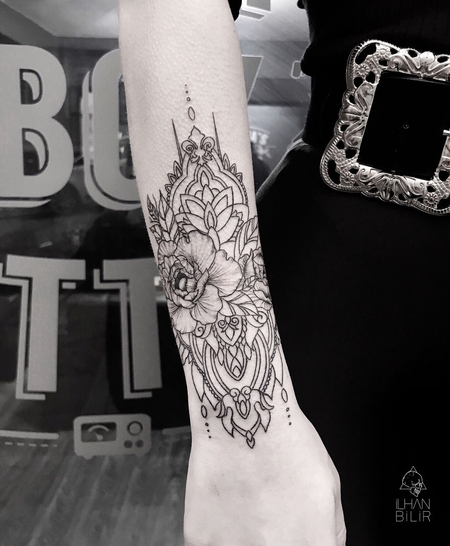 Tattoo showcasing simplicity, contrast, and dotwork by artist Ilhan Bilir on a person's forearm.