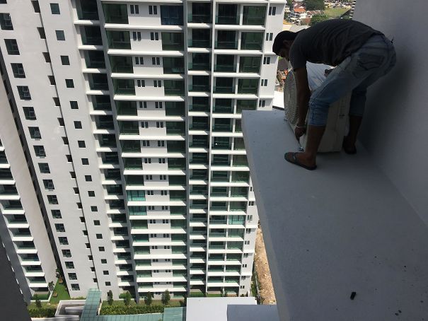 Fixing An AC Compressor On A Level 28 Ledge