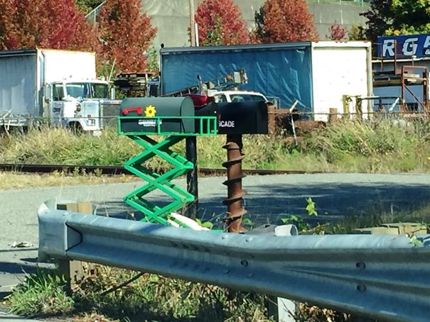 The Equipment Rental Company's Mailbox Stand Is A Scissor Lift, And The Drilling Company's Is A Huge Drill Bit