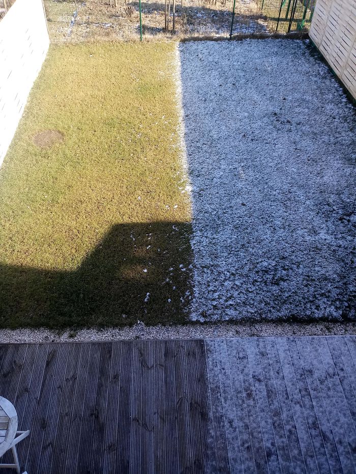 My Fence's Shadow Doesn't Let The Snow Melt, Making My Garden Half Green, Half White