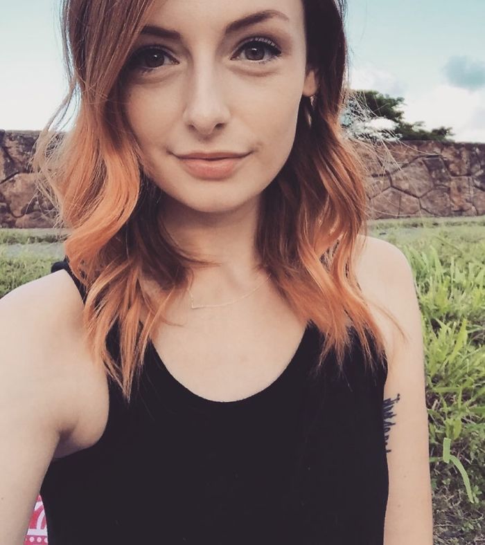 Woman with impeccable eyeliner after car accident, smiling outdoors. Woman with impeccable eyeliner after car accident, smiling outdoors.