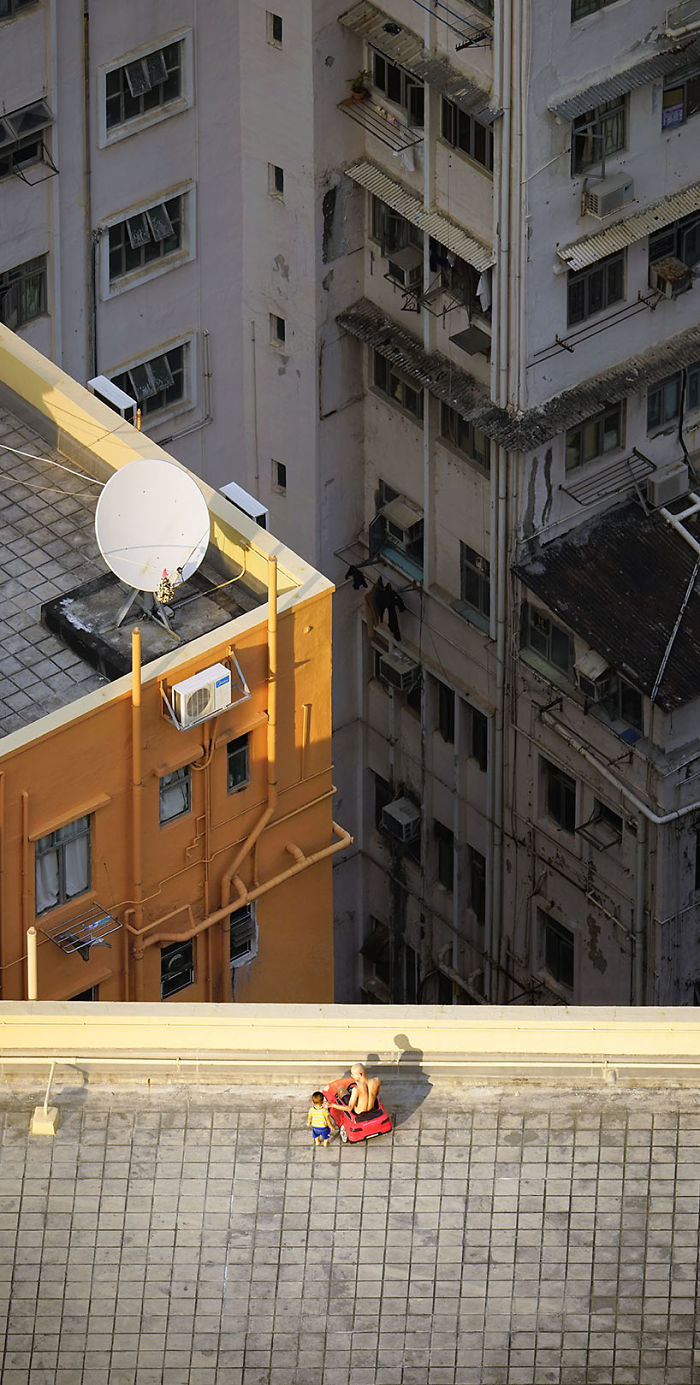 "Carjacking," A Daddy And His Son Are Playing On A Rooftop With A Red Toy Car