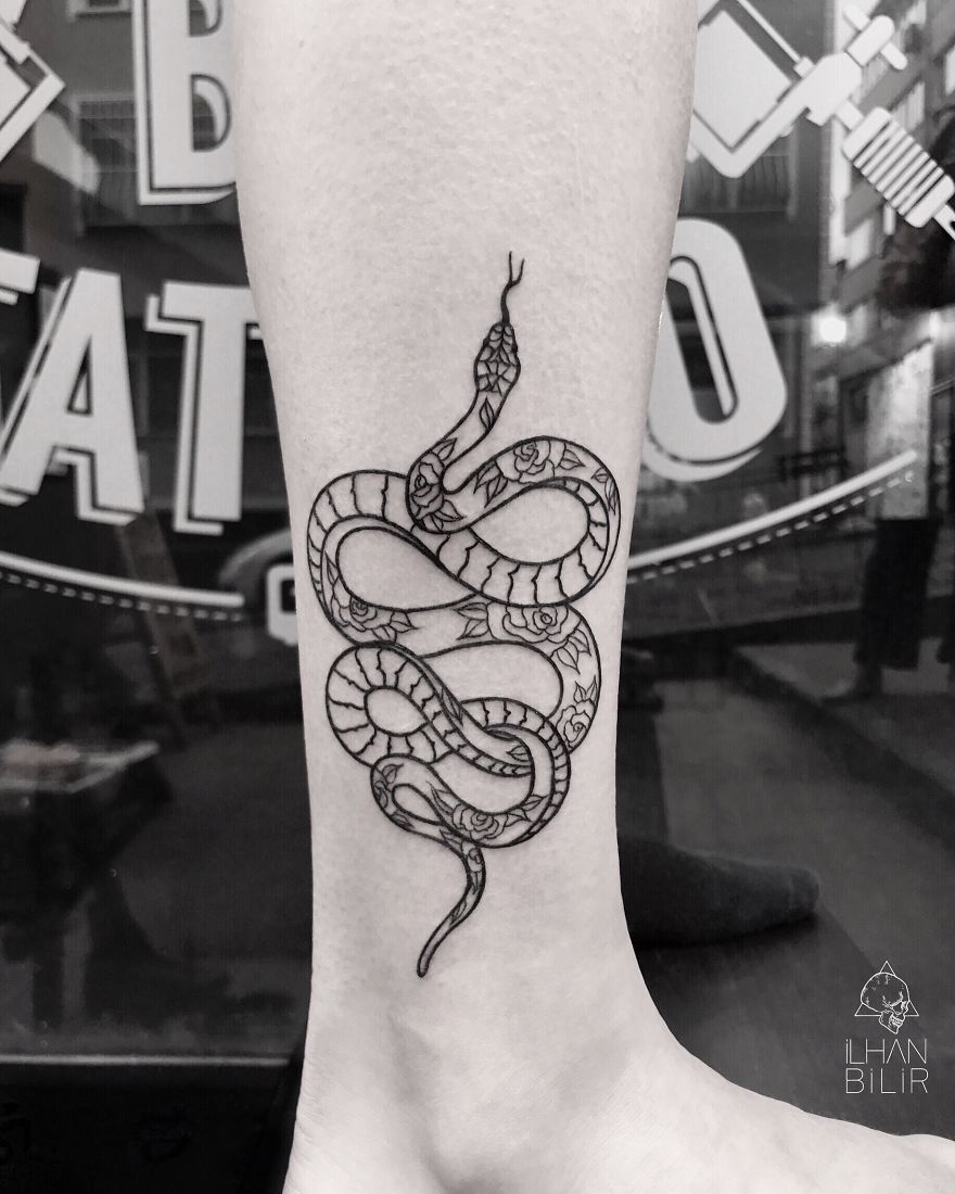Tattoo of a snake in dotwork and contrast style by Ilhan Bilir on a person's leg.