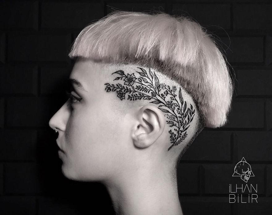 Profile view of dotwork tattoo on a person's shaved head, showcasing simplicity and contrast, created by Ilhan Bilir.