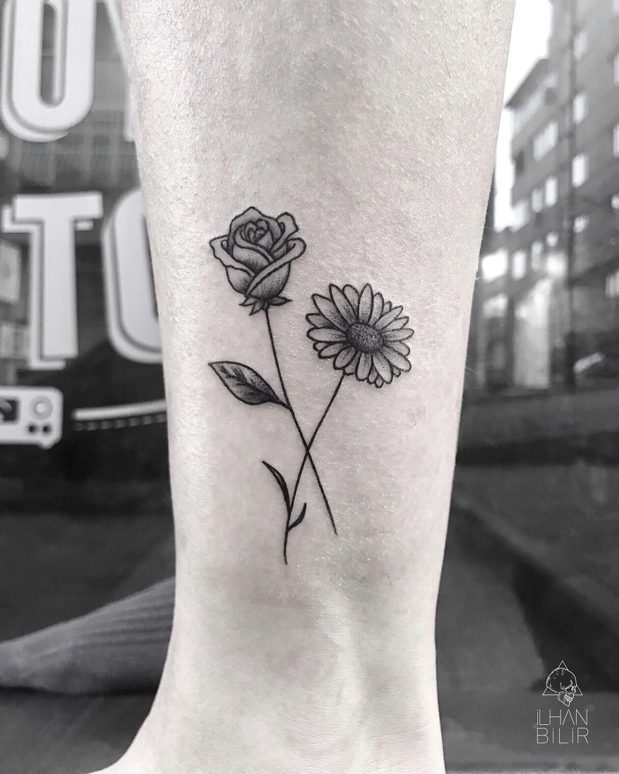 Rose and daisy tattoo by Ilhan Bilir showcasing simplicity and contrast in dotwork style.