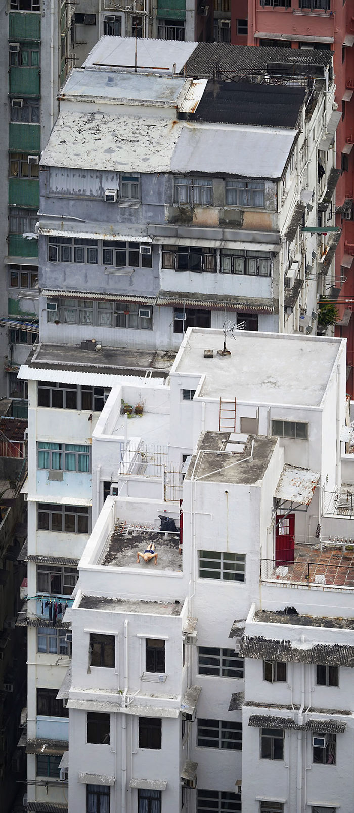 "Pushing Up," A Man Is Doing Some Physical Exercise On The Rooftop