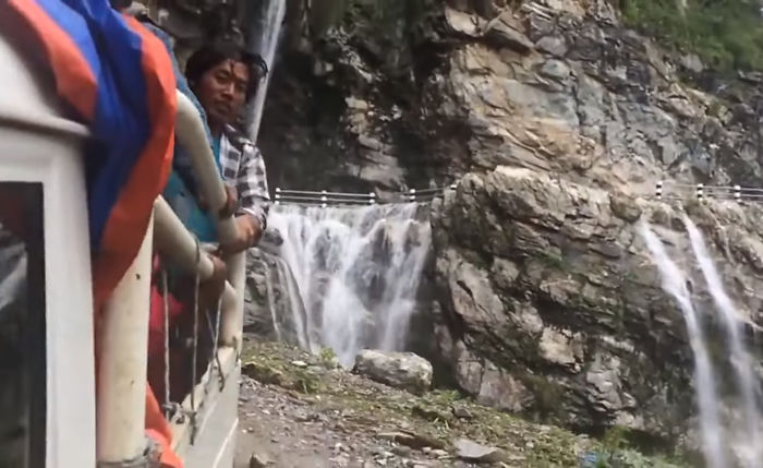 Driver Skillfully Navigates One Of The World's Most Dangerous Roads In Nepal That Runs Through A Waterfall Driver Skillfully Navigates One Of The World's Most Dangerous Roads In Nepal That Runs Through A Waterfall