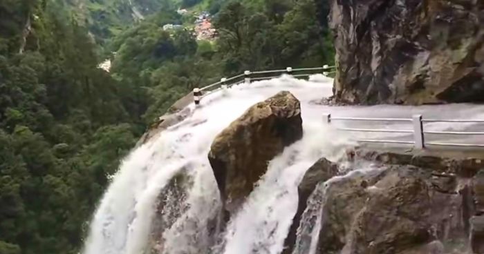 Driver Skillfully Navigates One Of The World’s Most Dangerous Roads In Nepal That Runs Through A Waterfall