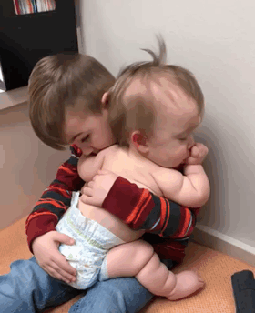 Big Brother Rocks His Ill Baby Sister To Sleep