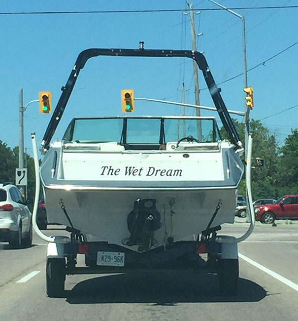 Funny named boat being transported 