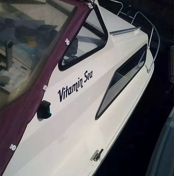 Funny white named boat 